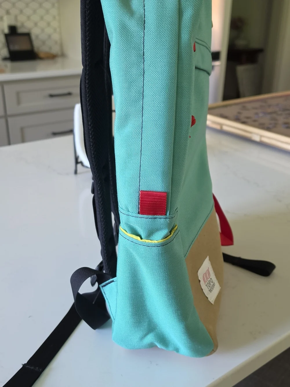 Topo Designs Turquoise and Tan Backpack.